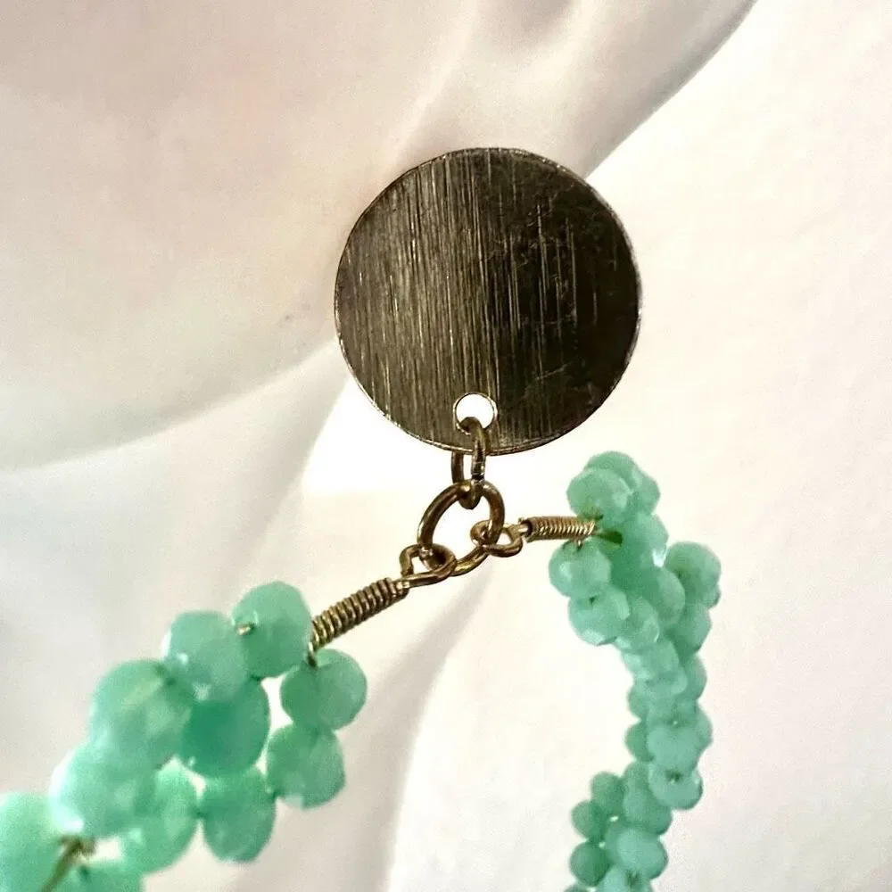 Large green floral circle statement earrings